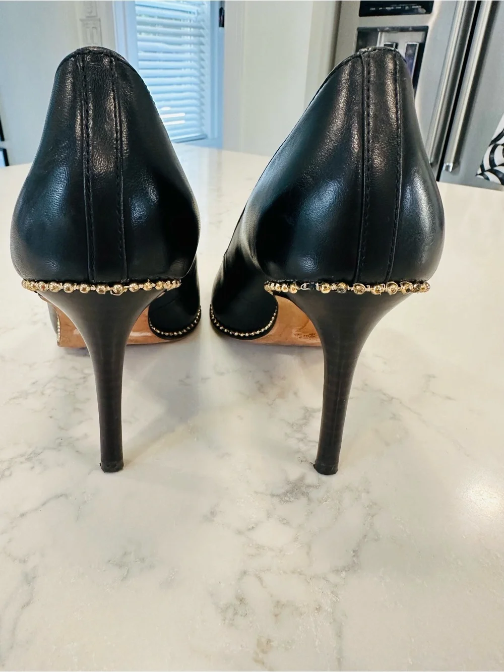 Coach Tamera Black Leather Pointed Toe Pumps with Gold Beaded Accent